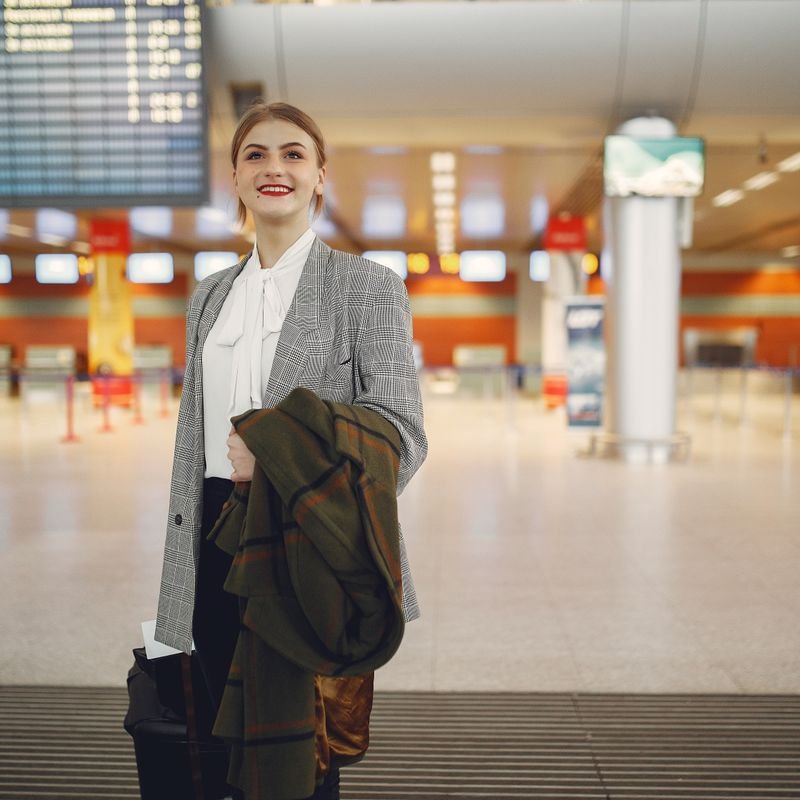 A businesswoman in an airport terminal