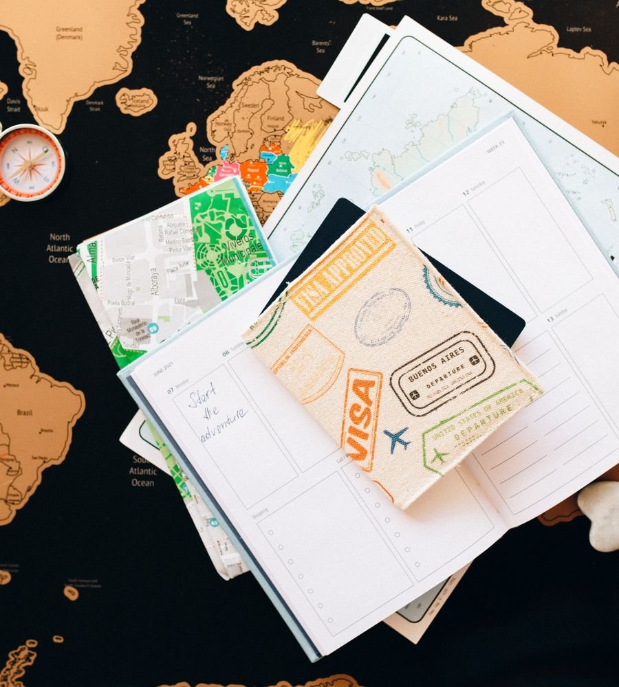 Maps, passports and notes on a planning desk